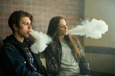 couple smoking vaping